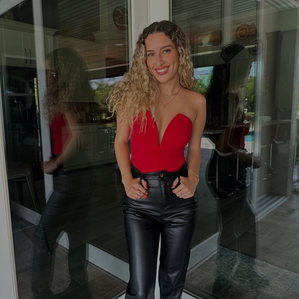 Red body suit with deep V neck line